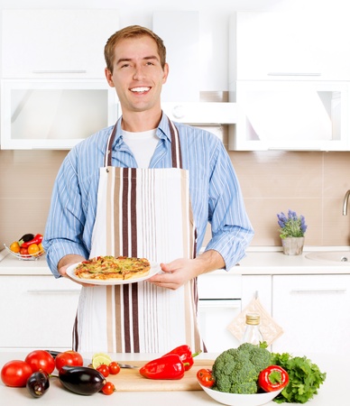 Young Man Cooking Pizza  Home  Kitchenの写真素材