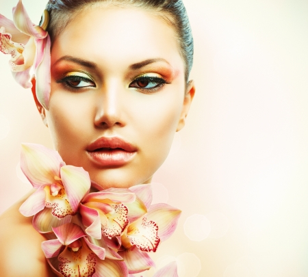 Beautiful Girl With Orchid Flowers  Beauty Woman Faceの写真素材