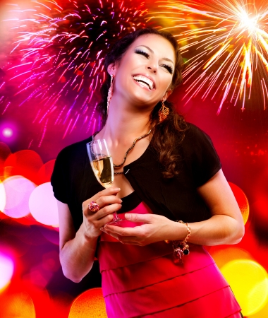 Beautiful Girl with Holiday Makeup Holding Glass of Champagne の写真素材
