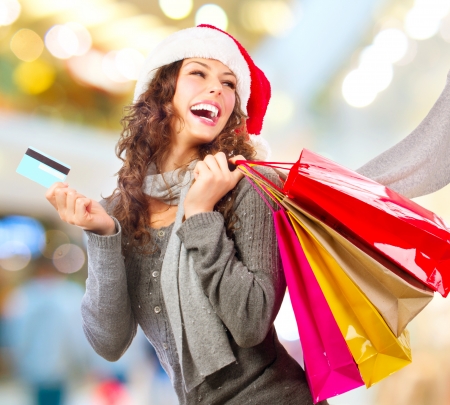 Christmas Shopping  Girl With Credit Card In Shopping Mall Salesの写真素材