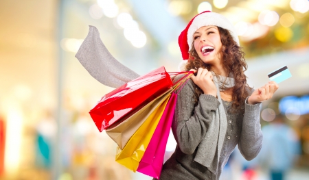 Christmas Shopping  Girl With Credit Card In Shopping Mall Salesの写真素材