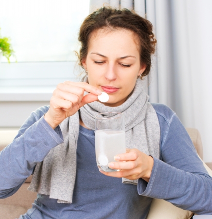 Ill Woman Taking Aspirin Pills  Headache の写真素材
