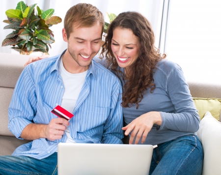 Online Shopping  Couple Using Credit Card to Internet Shop の写真素材