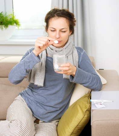 Ill Woman Taking Aspirin Pills  Headacheの写真素材