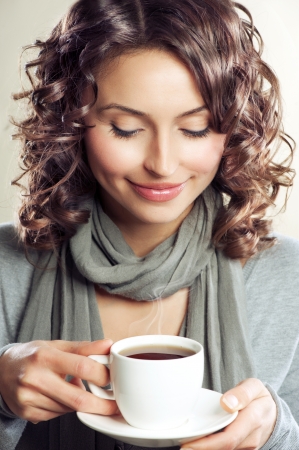 Beautiful Woman drinking Coffee or Tea の写真素材