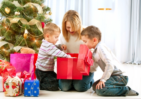 Happy Children with Christmas gifts の写真素材
