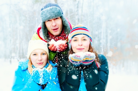 Family Outdoors  Happy Family Blowing Snow の写真素材