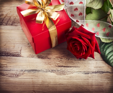 Valentine  Rose Flower and Gift Box over Wooden Background の写真素材