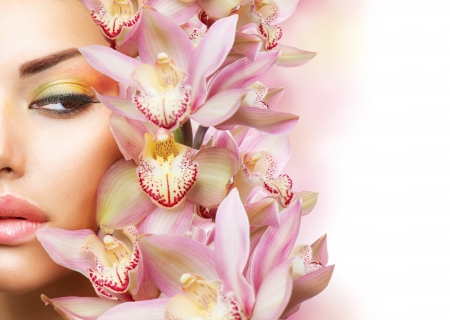 Beautiful Girl With Orchid Flowers  Beauty Model Woman Face の写真素材