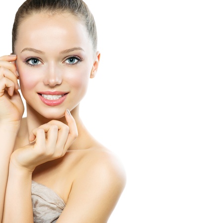 Beautiful Young Woman with Fresh Clean Skin touching her Face の写真素材