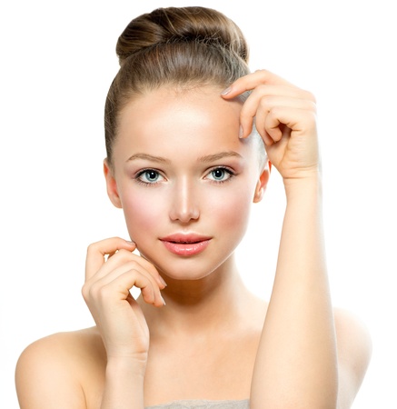 Beautiful Young Woman with Fresh Clean Skin touching her Face の写真素材