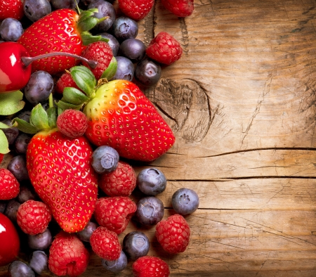 Berries on Wooden Background  Organic Berry over Wood の写真素材