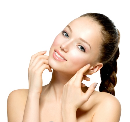 Beautiful Young Woman with Fresh Clean Skin touching her Face Beautiful Young Woman with Fresh Clean Skin touching her Face