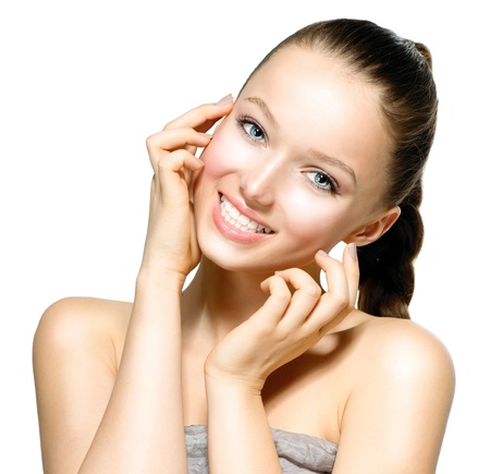 Beautiful Young Woman with Fresh Clean Skin touching her Face の写真素材