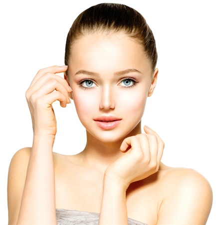 Beautiful Young Woman with Fresh Clean Skin touching her Face の写真素材