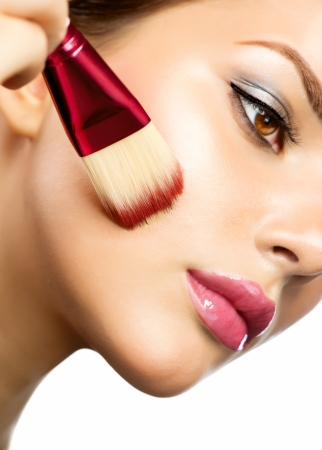Beautiful Young Woman Applying Makeupの写真素材