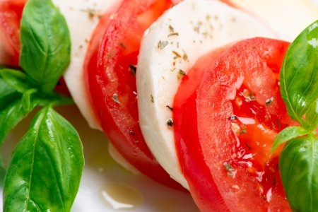 Caprese Salad  Tomato and Mozzarella slices with basil leaves の写真素材