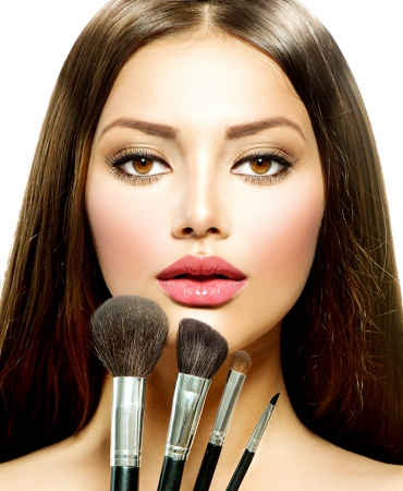 Beauty Girl with Makeup Brushes  Make-up for Brunette Woman の写真素材