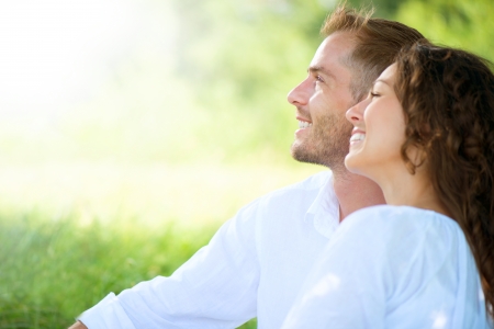Happy Smiling Couple Relaxing in a Park の写真素材