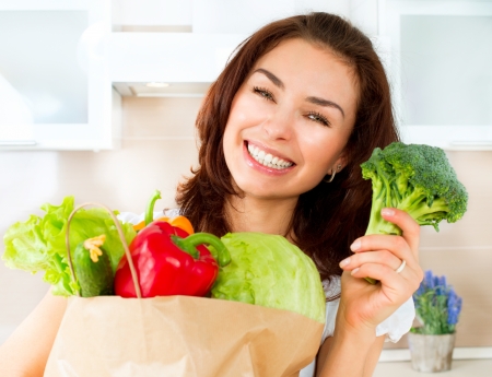 Happy Young Woman with vegetables in shopping bag  Diet Concept の写真素材