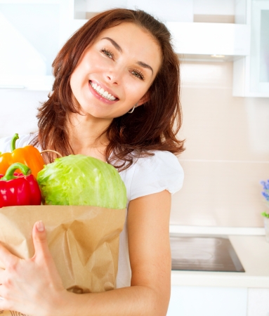 Happy Young Woman with vegetables in shopping bag  Diet Concept の写真素材