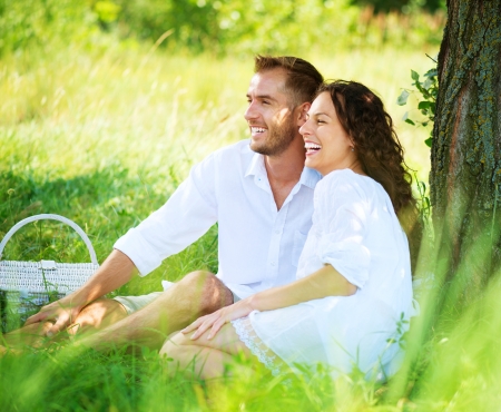 Young Couple Having Picnic in a Park  Happy Family Outdoor の写真素材