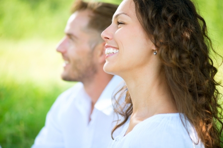 Happy Smiling Couple Relaxing in a Park  Picnicの写真素材