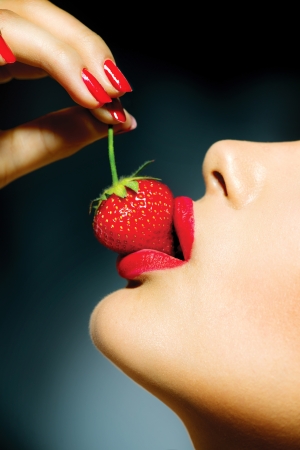 Sexy Woman Eating Strawberry  Sensual Red Lipsの写真素材