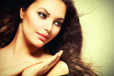 Beautiful Brunette Woman with Blowing Healthy Hair の写真素材