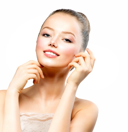 Beautiful Young Woman with Fresh Clean Skin touching her Face の写真素材