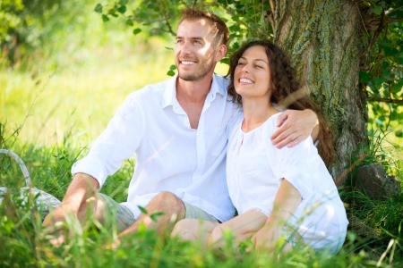 Young Couple Having Picnic in a Park  Happy Family Outdoor の写真素材