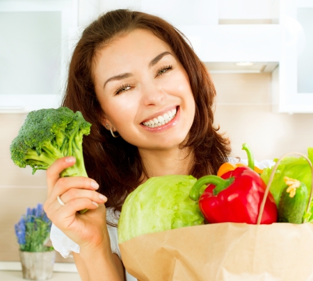 Happy Young Woman with vegetables in shopping bag  Diet Conceptの写真素材