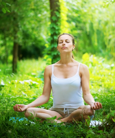 Yoga  Young woman doing yoga exercise outdoor の写真素材