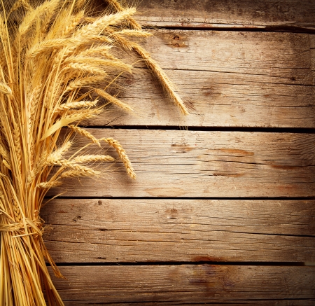 Wheat Ears on the Wooden Table  Harvest concept の写真素材