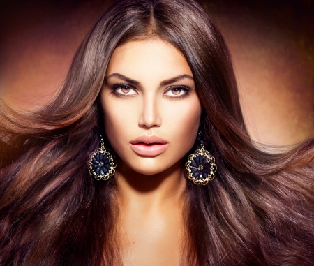 Glamour Beautiful Woman with Blowing Brown Hair の写真素材