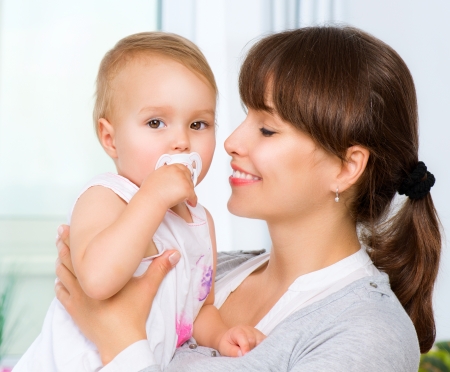 Mother and Baby kissing and hugging  Happy Familyの写真素材