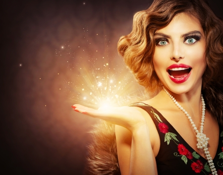 Retro Woman with Holiday Magic Gift in her Hand の写真素材