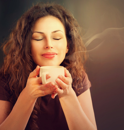 Beauty Woman With Cup of Coffee or Tea