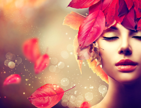 Autumn Woman. Fall. Girl with colourful autumn leaves hairstyle