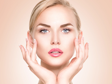 Beautiful spa girl touching her face. Perfect fresh skin Beautiful spa girl touching her face. Perfect fresh skin