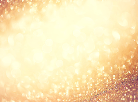 Golden abstract defocused background with blinking starsの写真素材