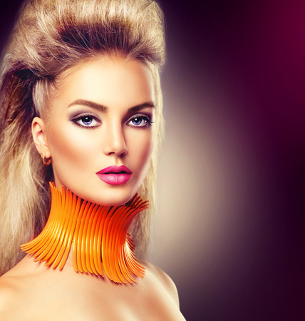 High fashion model girl with mohawk hairstyle and vivid make upの写真素材