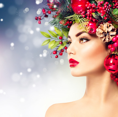 Christmas fashion model woman. Holiday hairstyle and makeupの写真素材