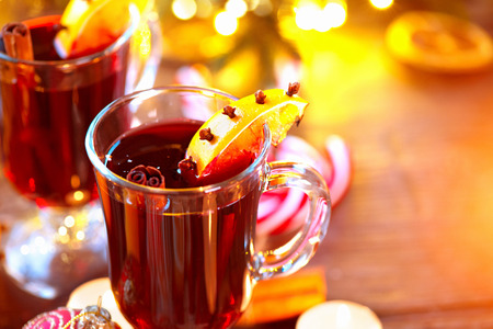 Traditional Christmas mulled wine hot drink. Holiday decorated Christmas tableの写真素材