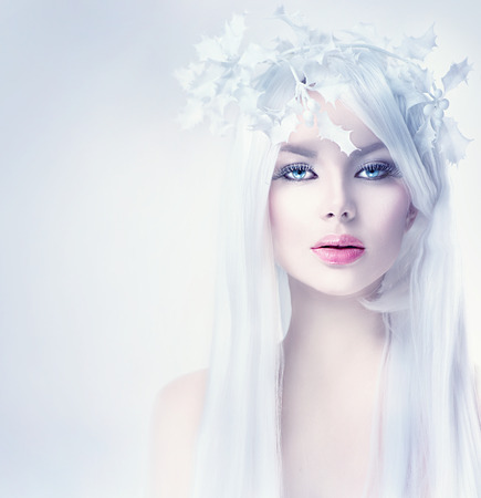 Winter beauty woman portrait with long white hairの写真素材