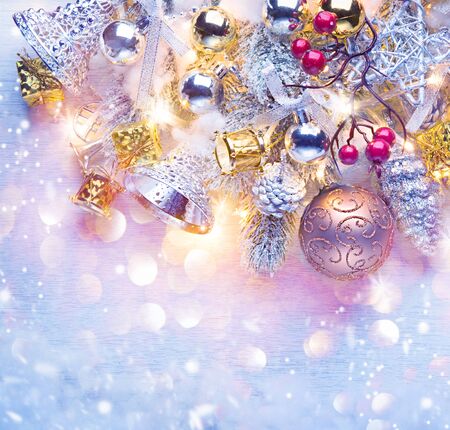 Christmas holiday background decorated with baubles and light garlandの写真素材