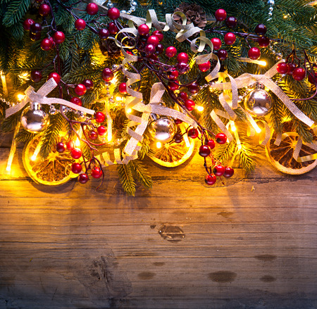 Christmas fir tree with decoration on dark wooden backgroundの写真素材