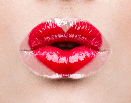 Valentine heart kiss on the lips. Makeupの写真素材