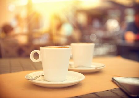 Morning coffee on the terrace in cafe. Cup of espressoの写真素材