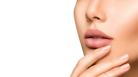 Perfect woman's sensual lips with fashion natural beige matte lipstick makeupの写真素材
